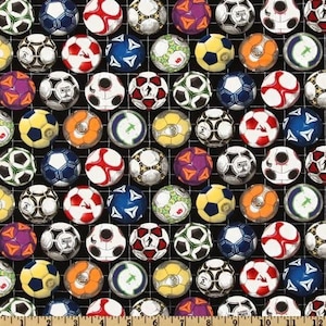 May include: A black fabric with a repeating pattern of colorful soccer balls. The soccer balls are arranged in a grid pattern and have a variety of designs.