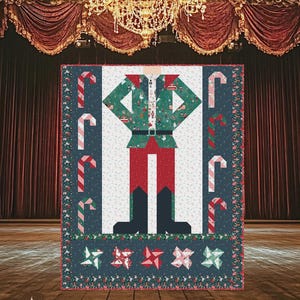 May include: A quilt pattern titled BE A NUTCRACKER featuring a central nutcracker figure in green, red, and black, surrounded by candy cane motifs on a dark blue background. The finished size is listed as 60 1/2 inches by 72 1/2 inches.