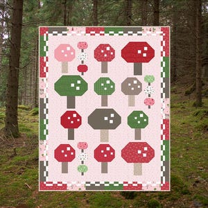 May include: A quilt pattern for a mushroom garden with a pink background and a checkered border. The pattern features red, green, and brown mushrooms with white spots. The finished size is 62 inches by 78 inches. The pattern is called "Mushroom Garden" and is by Sew A Story.