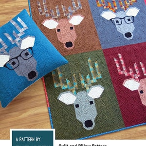 May include: A quilt and pillow pattern featuring a friendly deer design with optional glasses appliqué. The pattern includes instructions for making quilts and pillows in various sizes. The pattern is by Elizabeth Hartman.