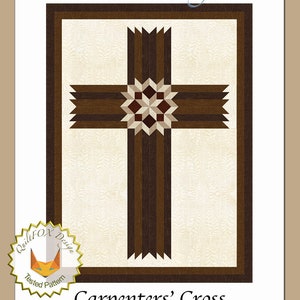 May include: A quilt pattern for a cross design with a brown and beige color scheme. The pattern is called "Carpenters' Cross" and is 42 inches by 57 inches. The pattern is by QuiltFOX Design.