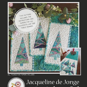 May include: A quilt pattern titled "Enchanted Forest" featuring instructions and papers for six placemats and one table runner. The placemats and table runner have a Christmas tree design with teal, pink, and white colors. The pattern is by Jacqueline de Jonge BeColourful.