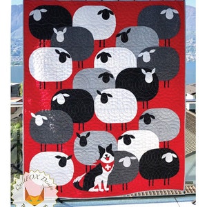 May include: A red quilt with a pattern of black, white, and gray sheep. The quilt is 55 inches by 70 inches and features a black and white dog with a red bandana and a Swiss flag.