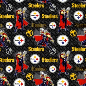 May include: A black and yellow Pittsburgh Steelers logo with a black and white image of Thor holding a hammer. The background is a black and gray pattern.