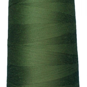 May include: A spool of dark green thread.