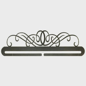 May include: A white ceramic mug with a black handle and the text "But First, Coffee" in a black, handwritten-style font. The mug is on a white surface.