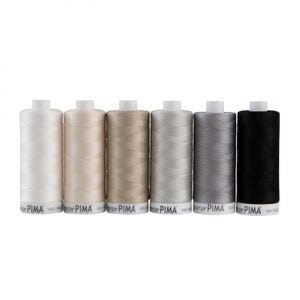 May include: Six spools of thread in various shades of beige, gray, and black. The spools are labeled "Superior PIMA 100% PIMA"