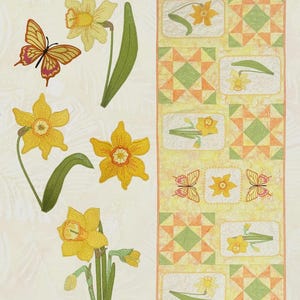 May include: A Daffodil Delight table runner with machine applique and quilting. The design features yellow daffodils and butterflies. The table runner has a repeating pattern of daffodils and geometric shapes in yellow, orange, and green.