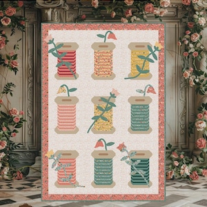 May include: A Garden Spools quilt pattern by Sew A Story featuring a light background with nine spools of thread wrapped in various floral fabrics, each topped with a flower stem. The finished size is 60.5 inches by 87 inches as stated.