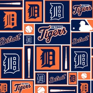 May include: A white background with a repeating pattern of blue and orange squares. The squares contain the Detroit Tigers logo, a baseball bat, a baseball, and the words "Detroit Tigers".