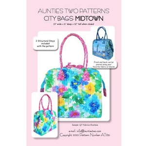 May include: A sewing pattern for a city bag, called "Midtown", with a floral print. The bag is 13 inches wide, 6 inches deep, and 12 inches tall when closed. The pattern includes two structural stays. The pattern is copyright 2020 and the pattern number is AT051.