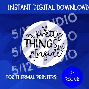 May include: A white circle with black text that reads "Pretty Things Inside" with stars and swirls around the text. The circle is on a blue background with the text "FOR THERMAL PRINTERS: 2" ROUND" below it.