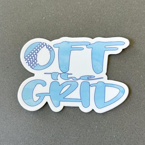 May include: A blue and white sticker with the text "OFF the GRID" in a stylized font. The "O" in "OFF" is replaced with a tire tread pattern.