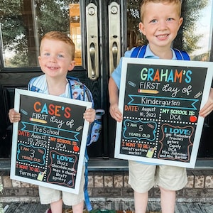 Shows children holding milestone chalkboard signs that are reusable to document milestones for the first and last day of school.