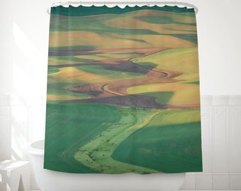 View of the countryside in your bathroom with this printed fabric shower curtain in multiple shades of green, yellow and brown. MW085