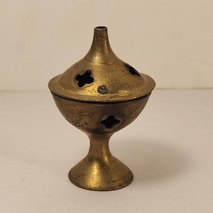 May include: A set of three ceramic mugs with a speckled, matte finish. Each mug features a different color: light blue, cream, and gray. The mugs have a simple, modern design and a comfortable handle.