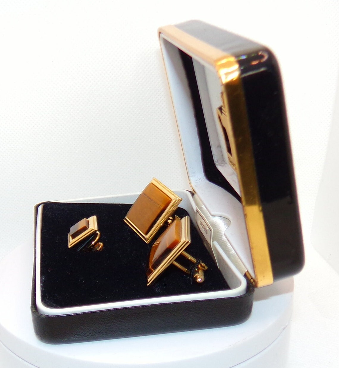 Cartier. A gold plated manual wind wristwatch with tiger's eye dial Tank, Circa 1970