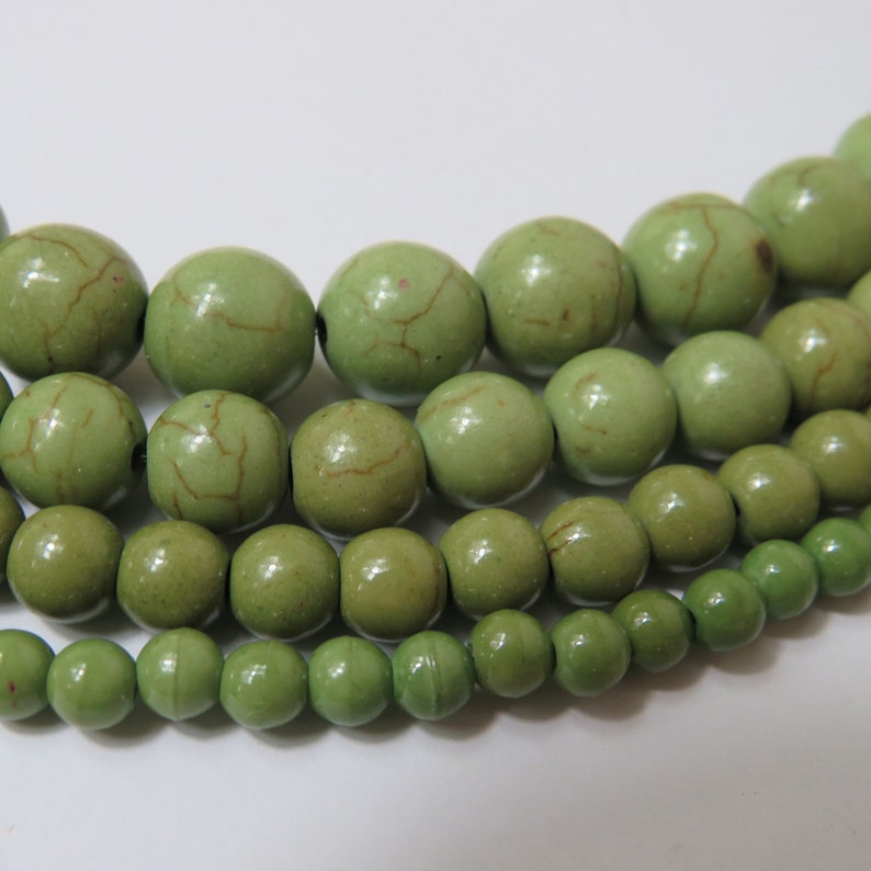 thumbnail image 2 of 25x 8mm Opaque Olive Green Glass Faceted Rondelle Beads 2 of 5