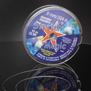 May include: A clear plastic spool of 0.024 inch diameter stretch magic bead and jewelry cord. The spool is labeled with the text "Stretch Magic" and "10 m 32.9ft".
