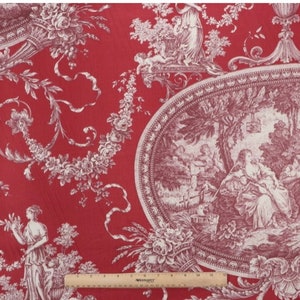 May include: Red fabric with a white toile pattern featuring a repeating design of urns, flowers, and figures in a pastoral setting. The fabric has a subtle texture and a vintage aesthetic.
