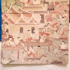 May include: A rectangular box with a detailed, multi-figure illustration depicting a traditional scene. The artwork features figures in various activities, with buildings and water elements. The color palette is dominated by warm earth tones, with accents of red and blue.