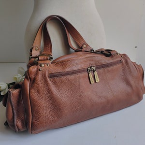 French vintage, tan leather shoulder bag, with two top handles, Sabrina Paris.