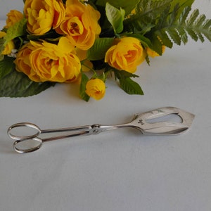 Christofle cake / serving tongs, silver plated with O C stamp, mid century Paris flatware.
