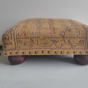 French vintage foot stool, wooden feet and fabric covered cushion top, circa mid century.