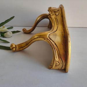 French vintage wooden wall mounted console table / shelf, gold painted in antique style, circa mid century.