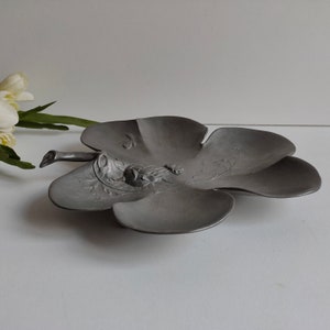 Antique Kayserzinn pewter dish, footed with maker marks and Art Nouveau relief design, circa 1900.