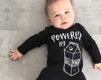 Powered by Milk Baby Romper: Funny Newborn Gift