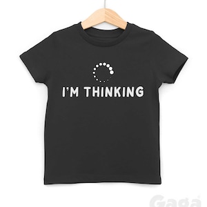 May include: Black t-shirt with a white loading circle graphic and the text "I'M THINKING".