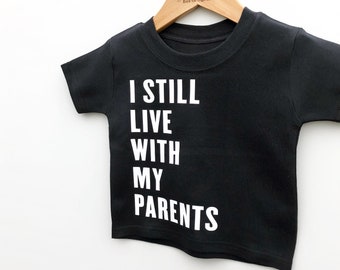 I Still Live With My Parents, Funny Kids/Baby T-Shirt New Parents Gift Tired Parents Tired Dad Gift for Parents Slogan Top Kids/Baby Clothes