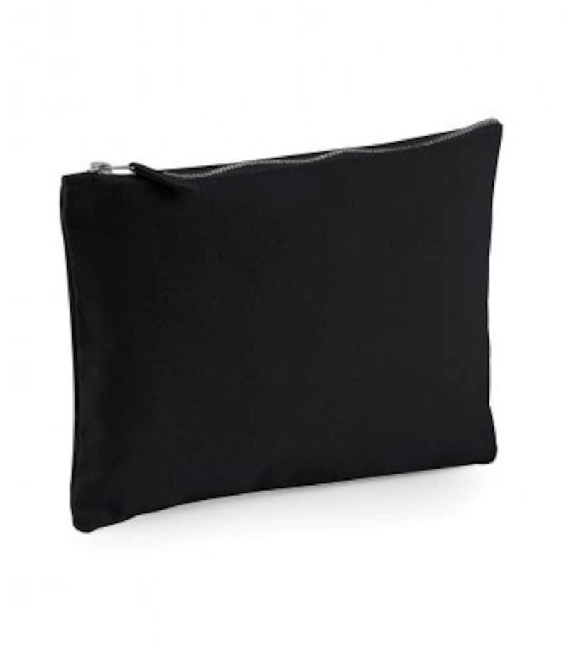 May include: A black canvas zippered pouch. The pouch is made of a soft, durable fabric and has a zipper closure.