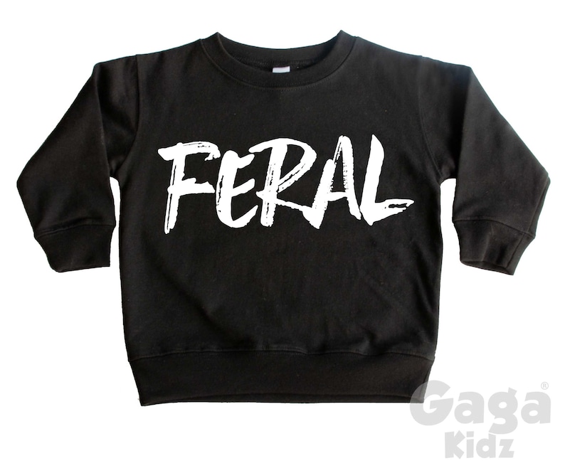 May include: Black long-sleeve sweatshirt with the word "FERAL" printed in white on the front.