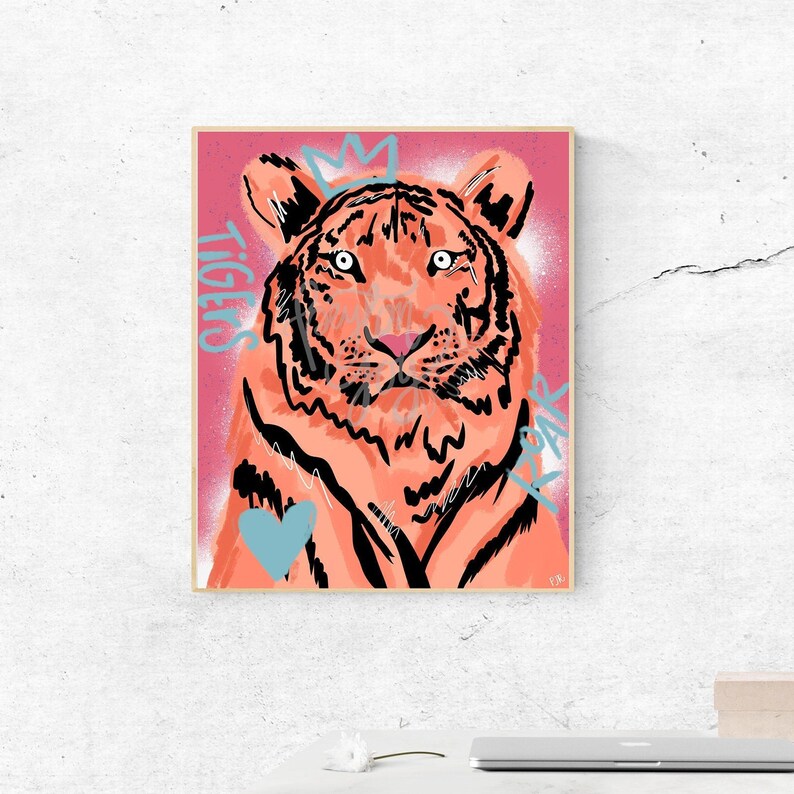 May include: A digital illustration of a pink tiger with black stripes and a crown on its head. The background is a pink and red gradient with the words "Tigers Roar" written in blue.