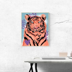 May include: A digital illustration of a tiger with a crown on its head. The tiger is orange and black with a purple heart on its chest. The words "TIGERS" and "ROAR" are written in purple on the background.