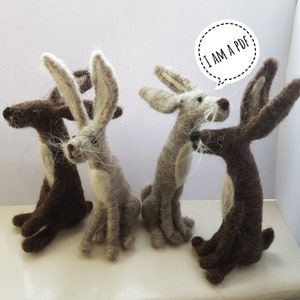 May include: Four felt animal figurines, two brown and two grey, with long ears and long legs. The grey figurines have white accents. The brown figurines have a more realistic look. The text "I AM A PDF" is in a speech bubble above the figurines.