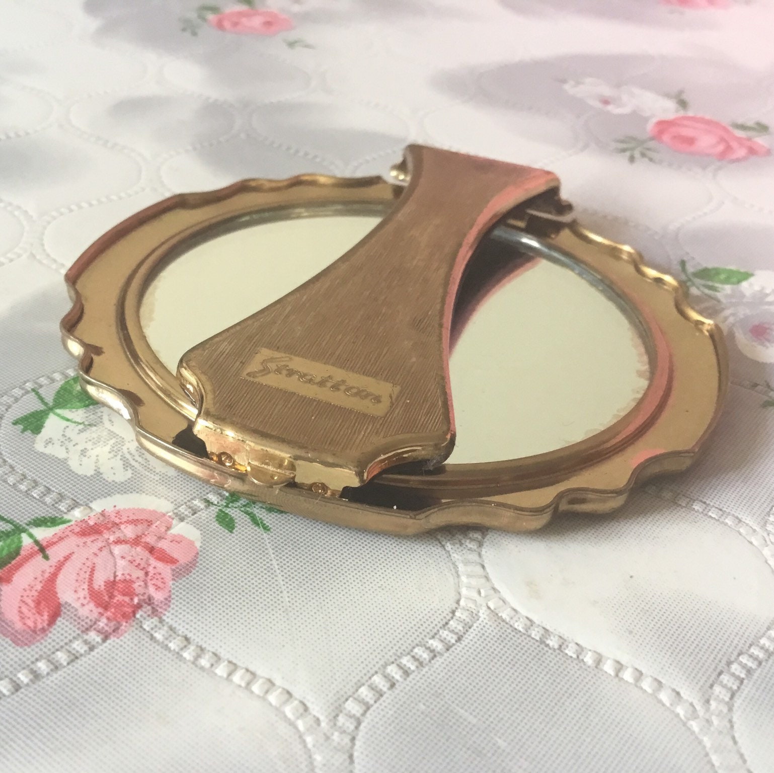 Stratton Petite magnifying hand mirror, c 1950s, vintage gold tone