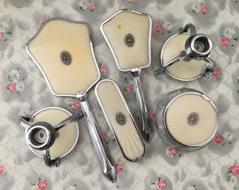 Vanity brush set with faux guilloche hand mirror, hairbrush, powder bowl, pair of candlesticks and clothes brush, mid century dresser set
