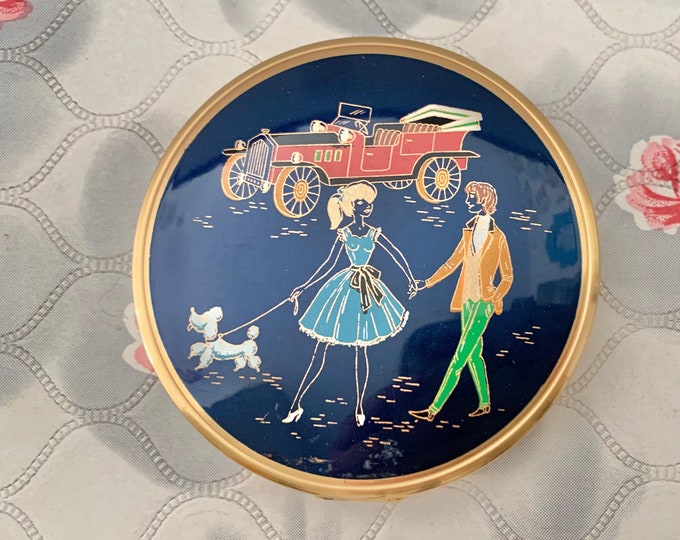 Loose or cream powder compact, with classic car, vintage couple and poodle, gold tone makeup mirror c1960s or 1970s