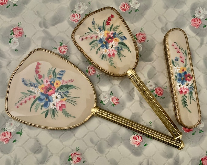 Featured listing image: Vintage dresser set with hand mirror, clothes brush and hairbrush, mid century brush set with embroidered pink and blue flowers