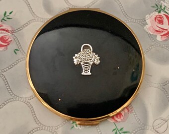 Melissa loose powder compact with black lid and basket of marcasite flowers, c1940s to 1950s makeup mirror