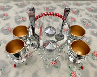 Atomic chrome plate egg cups and spoons, with salt and pepper pots, 1950s Zimco Brand breakfast set