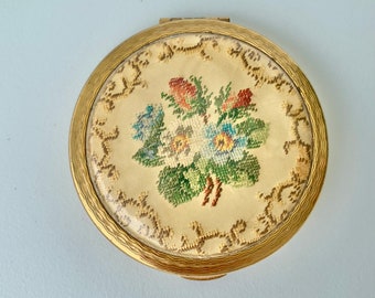 Kigu petit point powder compact with embroidered pink and blue flowers, c1950s