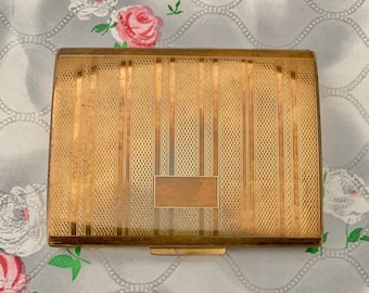 Stratton wiper compact for loose powder, mid century vintage self cleaning makeup mirror c 1950s