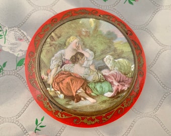 Vintage French powder compact with romantic shepherdess and lamb, c1930s red plastic Bakelite makeup mirror