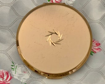 Stratton cream powder compact, gold tone with diamond cut wreath, c 1960s or 1970s makeup mirror compact