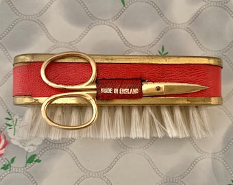 Red leather and brass vintage manicure set, with clothes or nail brush