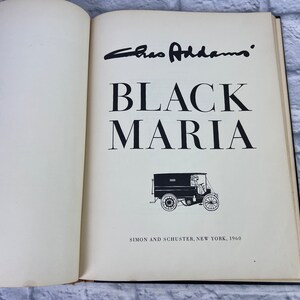 May include: A black and white image of a book titled "Black Maria" by Caro Addams. The book cover features a black and white illustration of a vintage delivery truck.